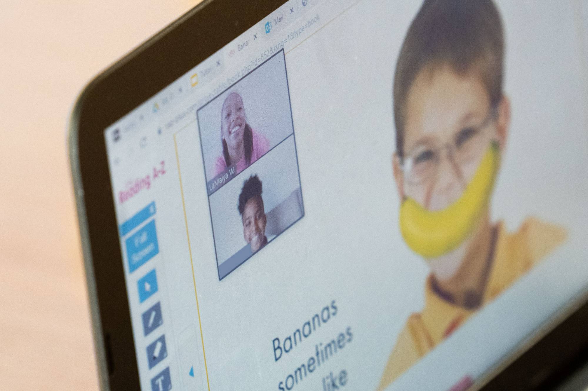 Kids participating in a zoom classroom presentation
